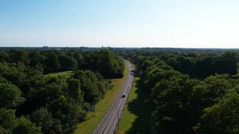 A drone flies over the streets overlooking a beautiful road Vídeos de archivo 248469427
