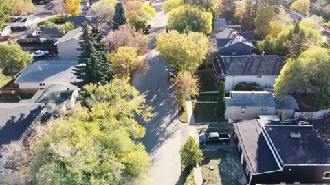 Drone Flies Over Suburbs in Fall with Trees and Houses Stock-Footage 140079484