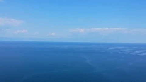The drone flies over the surface of the water. Lake Baikal, nature of Russian Stock Footage 123793491