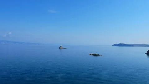 The drone flies over the surface of the water. Lake Baikal, Russia. Aerial Video 스톡 동영상 123793871