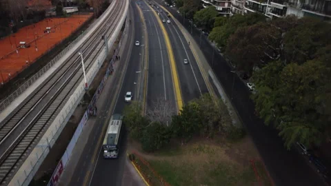 The drone flies up over the track, parallel to the railway bridge Stock Footage 247425933