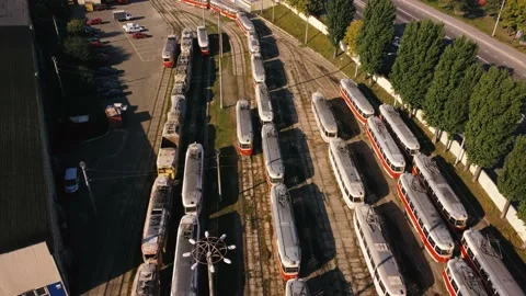 Drone flies over tram depot, during the day. tramcars stand in the parking lot Stock Footage 190363326