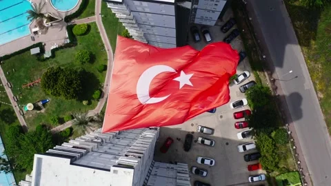 Drone flies over the Turkish flag at an angle of 90 degrees 4K Stock Footage 240001009