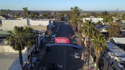 Drone flies over UNIVERSITY HEIGHTS sign in San Diego facing north Stock Footage 102821553