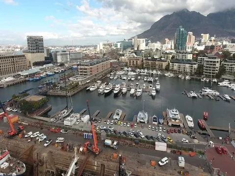 Drone flies over V&A Waterfront yacht club at Cape Grace hotel, Cape Town Stock Footage