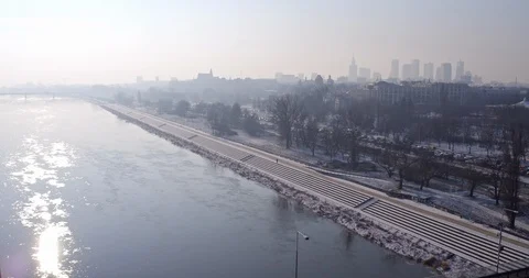 The drone flies over the Vistula river, in which the blue sky and the sun's r Stock Footage 112155412