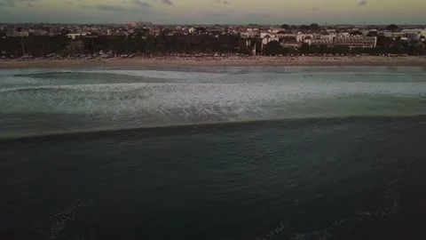 A drone flies over the waves of the sea in the evening in Indonesia. Stock Footage 155998782