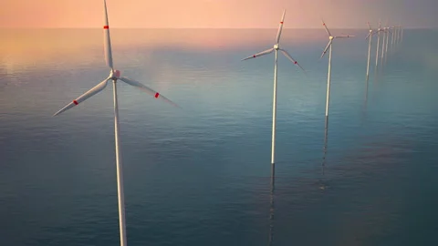 Drone Flies Over a Windmill Park at Sunset. Aerial View of a Farm With Wind Turb Stock Footage 210340542