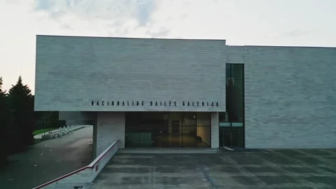 Drone flies parallel to the National Gallery building in Vilnius 動画素材 251748986