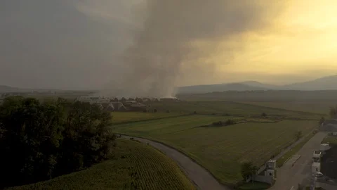 The drone flies past the fire. 스톡 동영상 115360691