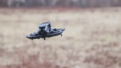 The drone flies past the operator Stock Footage 235467026