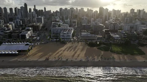 Drone flies to the right along Cabo Branco Beach facing the sunset Vidéo 279867351