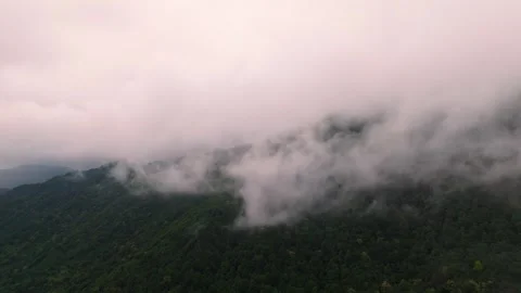 Drone flies right next to the clouds in the mountains  Stock Footage 298531567