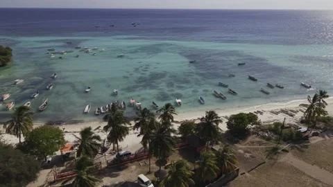 Drone flies sideways along beach looking out to sea Stock-Footage 346480906