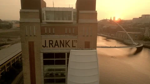 Drone flies sideways from Baltic Centre Gateshead to reveal Millennium Bridge Stock Footage 275230375