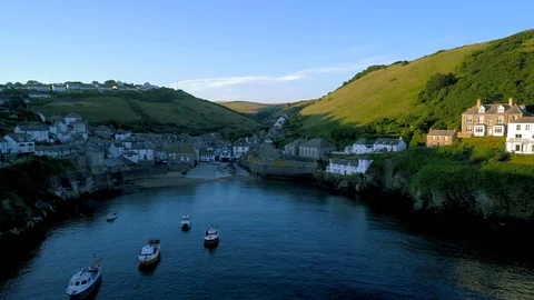 Drone flies sideways at low level over the harbor of Port Isaac Stock Footage 95828475