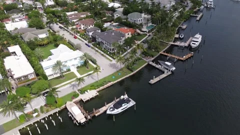 Drone Flies Sideways Over Florida Island Neighborhood With Docks, Pools And Stock Footage 343305621