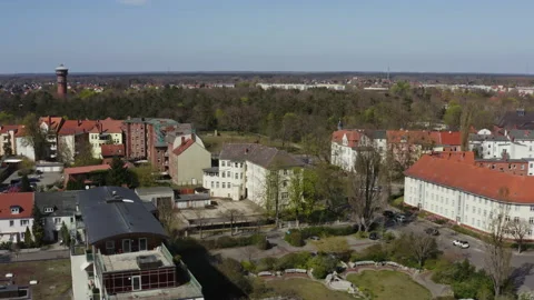 The drone flies sideways over the roofs of the town of Wittenberge in Stock Footage 163123856