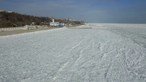 Drone flies slowly forward across the frozen Black Sea Stock Footage 72556668