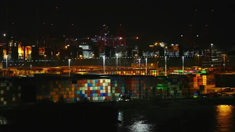 A drone flies slowly with a view of the container port of the hanseatic city of Stock Footage 239112806