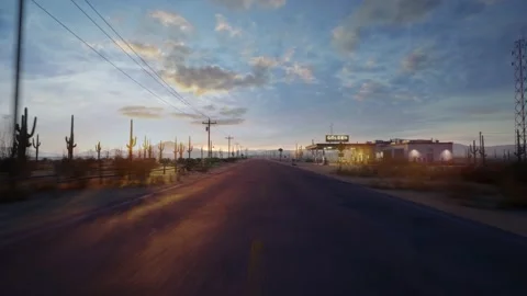 A drone flies straight over a long and empty road in the middle of the desert Stock Footage 183395541