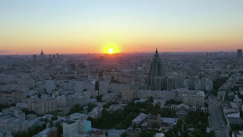 Drone flies at sunset parallel to the sun. Video stock 110723864