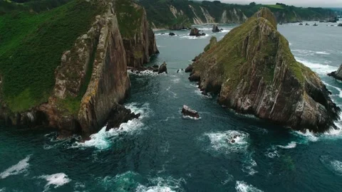 The drone flies through the beautiful rocks above the sea. Stock Footage 150069580