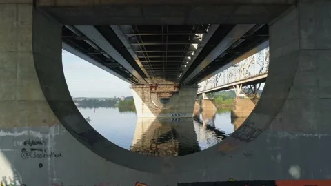 Drone flies through the bridge supports Stock Footage 130233239