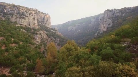 Drone flies through canyon. Raw footage included with the color graded version. Stock Footage 90998127