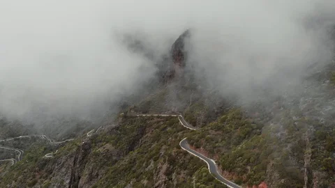Drone flies through the clouds in the beautiful mountains. Thick clouds Stock Footage 111308387