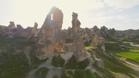 Drone flies through a hole in a house in Cappadocia 4k Stock Footage 254775763