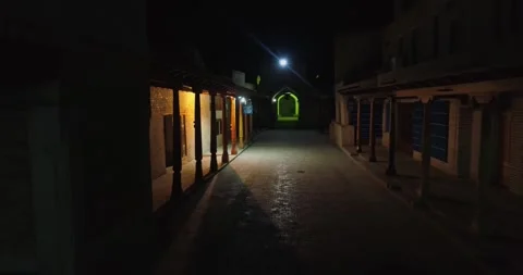 The drone flies through the night streets of the ancient city among old columns. Stock Footage 277869656
