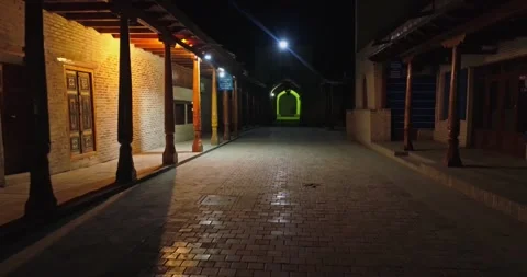 The drone flies through the night streets of the ancient city among old columns. Stock Footage 308008919