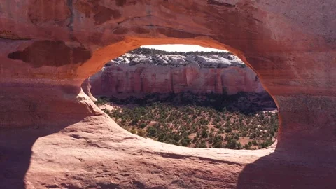 Drone Flies Through Red Orange Stone Arch With Massive Rock Formations In Utah Stock-Footage 285876517