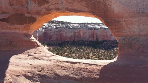 Drone Flies Through The Red Stone Arch With Massive Rock Formations Stockbeeldmateriaal 119416188