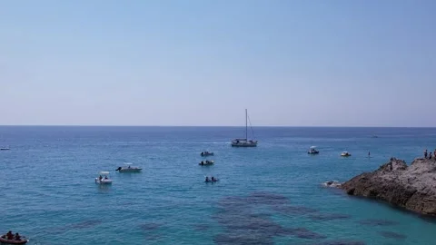 Drone flies through a sea cave revealing stunning views of turquoise wate Stock Footage 315059654