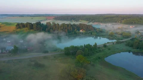 Drone flies through two lakes Stock Footage 158008390