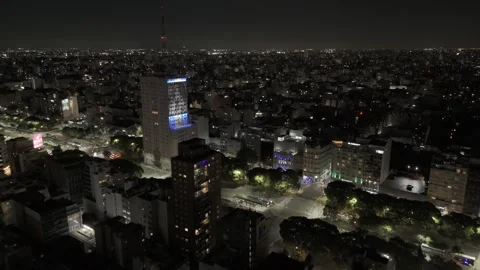 Drone flies toward a lit up Cantero Central Verano Porteño building Stock Footage 297237189