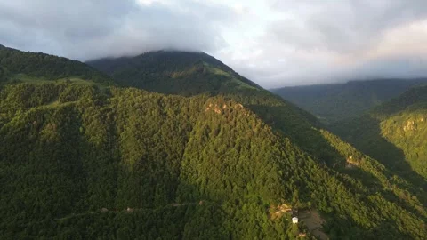 Drone flies toward mountain ridge with light and shadow contrast, Adjara, Georgi Stock Footage 337337869