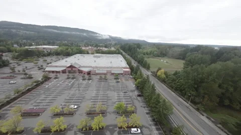 Drone Flies Towards Costco Looking Down (Desaturated) Video stock 252632448