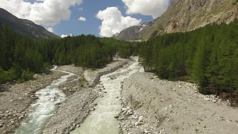 Drone flies towards over an alpine river in Italy during summer. Stock Footage 145946461