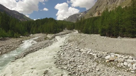 Drone flies towards over an alpine river in Italy during summer. Stock Footage 145947077