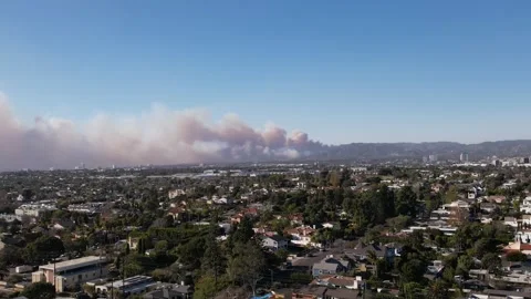 Drone flies towards Palisades Fire burning on Day one in Los Angeles 2025 Stock Footage 302692992