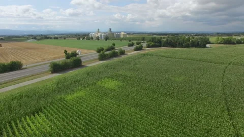 Drone flies towards a wheat silo in France Stock Footage 145990813