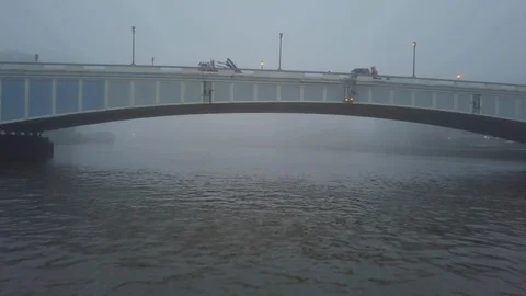 Drone Flies Under Bridge to Vertical Rise on Foggy Morning Stock Footage 103513192