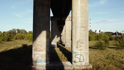 Drone Flies Under a Railway Overpass Bridge Between the Supports Stock Footage 332058072