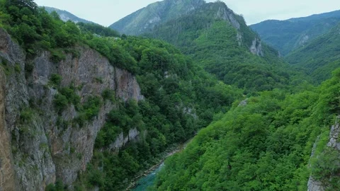 Drone Flies Under Tara Bridge with River and Mountain View – Montenegro – 4K Stock Footage 313900737