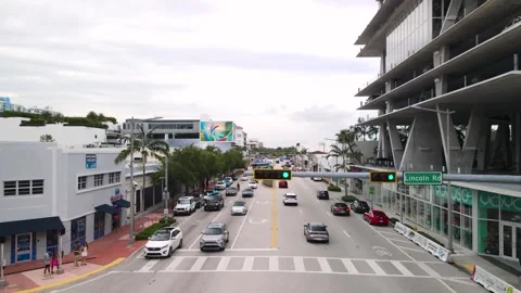 Drone Flies Under Traffic Light, Cars Driving on Alton Road, Miami 4K Stock Footage 245187007
