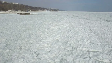 Drone flies very low over the frozen Black Sea Stock Footage 72557669