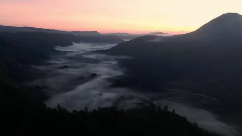 The drone flies very slowly over the clouds during dawn. Stock Footage 142987179